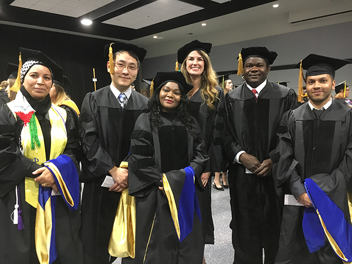 Photo of four UMKC School of Pharmacy graduates who participated in the 2018 Mid-Year Commencement ceremony