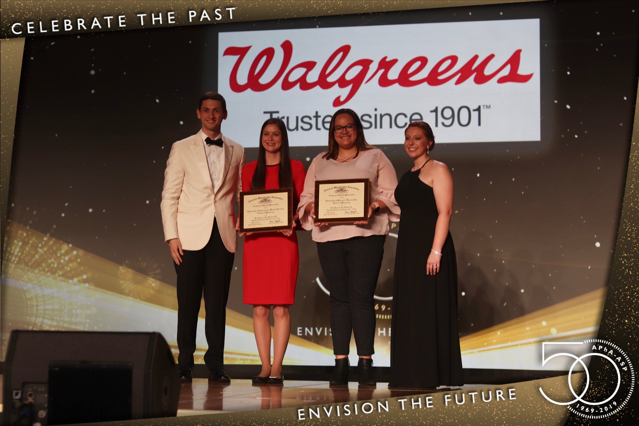 Pharmacy student Maddie Leal, president of the APhA-ASP chapter in Columbia, Mo., accepts the second-place National Chapter award.