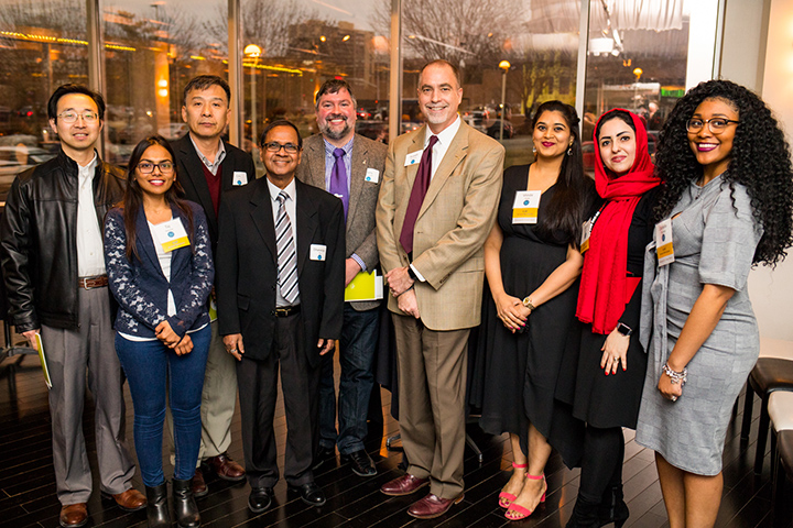 Pharmacy students and others from the school accept awards from the Women's Council Graduate Assistance Fund reception