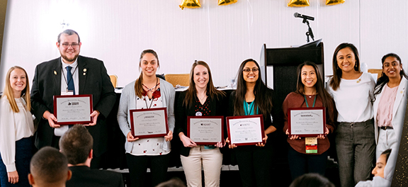 Pharmacy students pose with chapter awards at 2019 regional APhA-ASP meeting