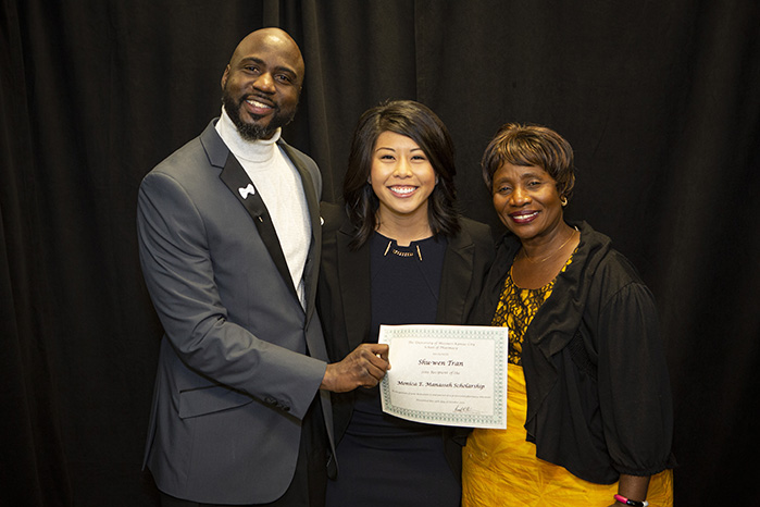 Fredrick Manasseh and his mother Monica present a certificate to the recipient of the 2019 Monica E. Manasseh Scholarship Award recipient 2019 Monica E. Manasseh Scholarship Award